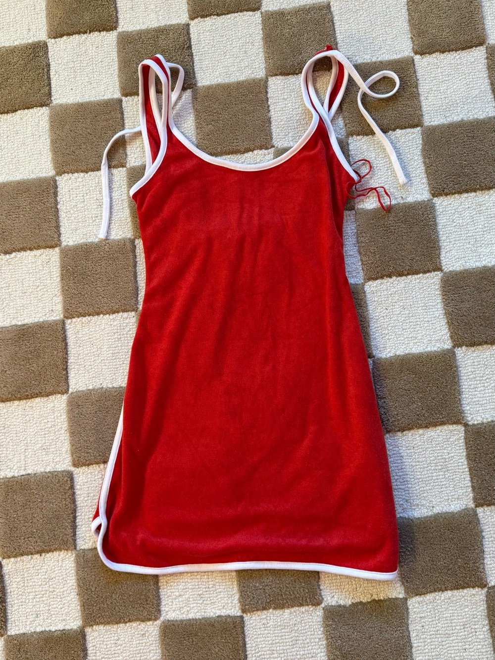 Red swimsuit cover up with white trim
